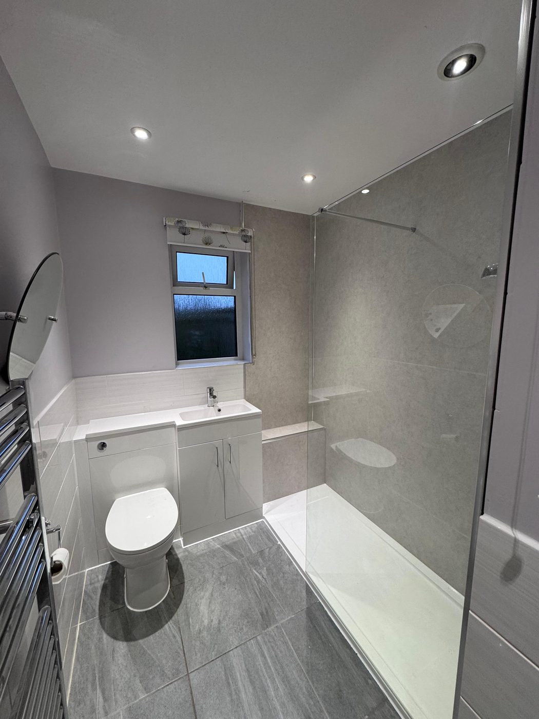 Bathroom in Exeter after — grey walk-in shower fitted where the bath was