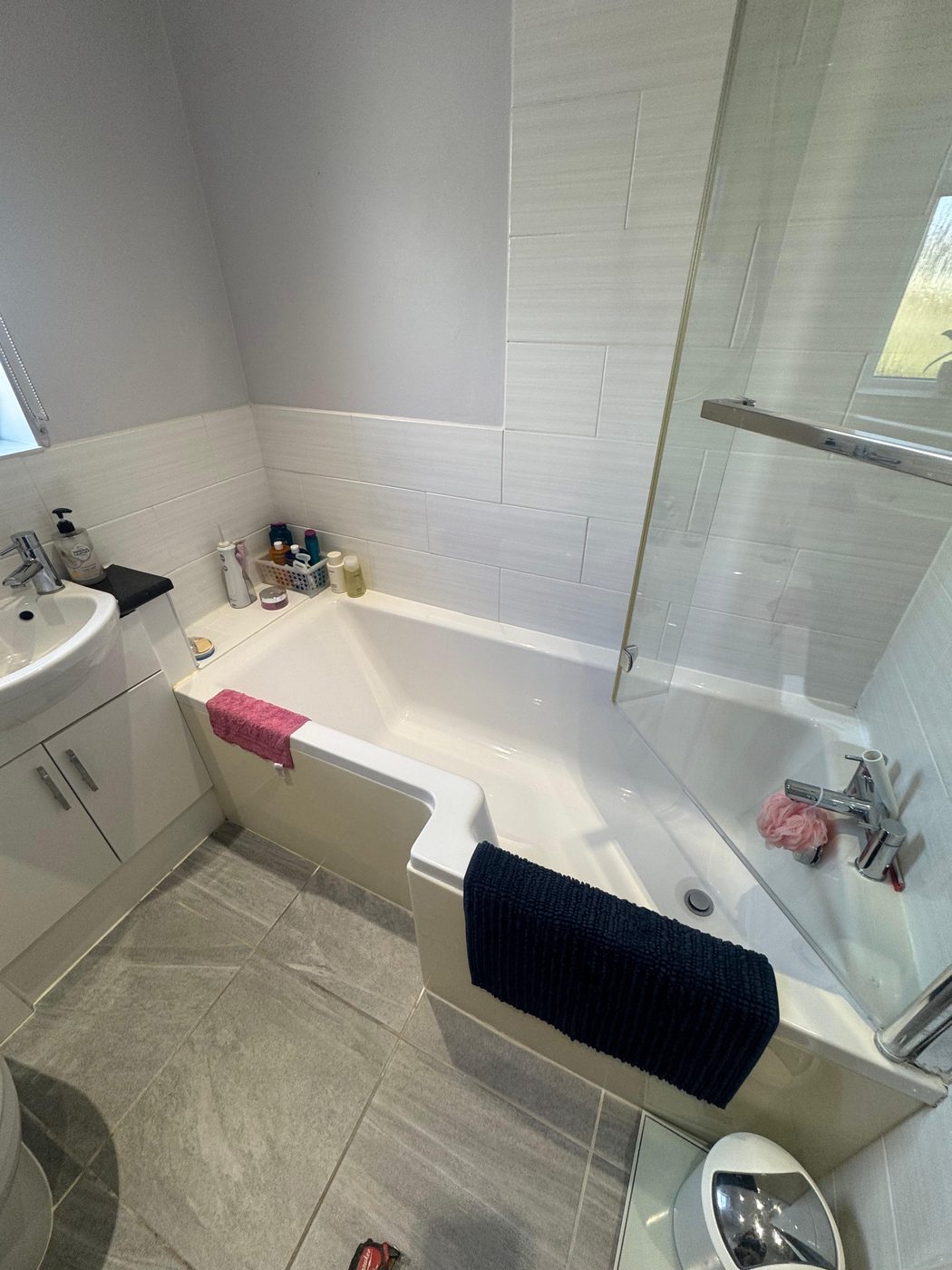 Bathroom in Exeter before — old bath with shower over