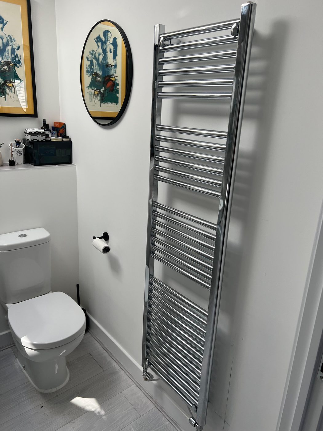 Cloakroom in Exeter after — new chrome heated towel rail